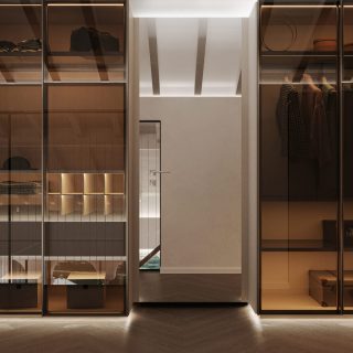 Luxurious bedroom with a transparent walk-in closet showcasing stylish clothes and accessories, illuminated shelves, and warm ambient lighting.