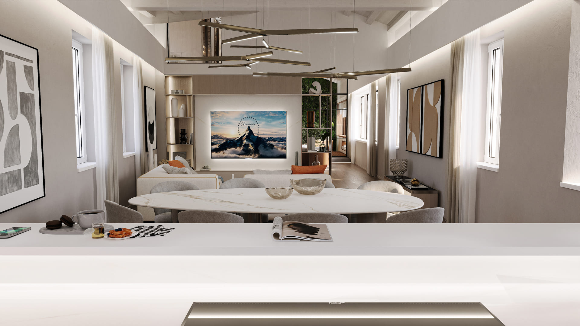 A stylish dining space featuring a white marble table, modern artwork, and sleek overhead lighting, with a breakfast counter in the foreground.