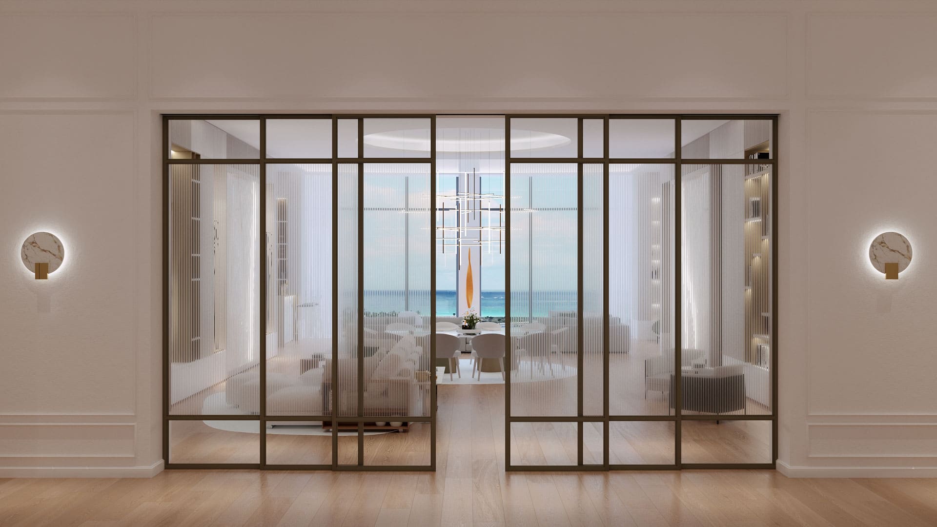 View through elegant glass doors into a modern dining room with a view of the ocean, showcasing a striking chandelier above a white table set, framed by minimalist wall sconces and sheer curtains.