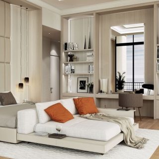 A contemporary bedroom with a large bed, white and orange pillows, elegant wall-mounted lighting, and a reading nook by the window, complemented by built-in bookshelves and a cozy chair, all in a palette of neutral tones.